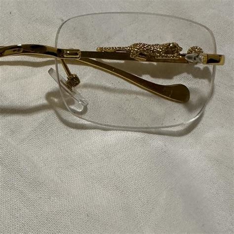 cartier glasses with jaguar on side